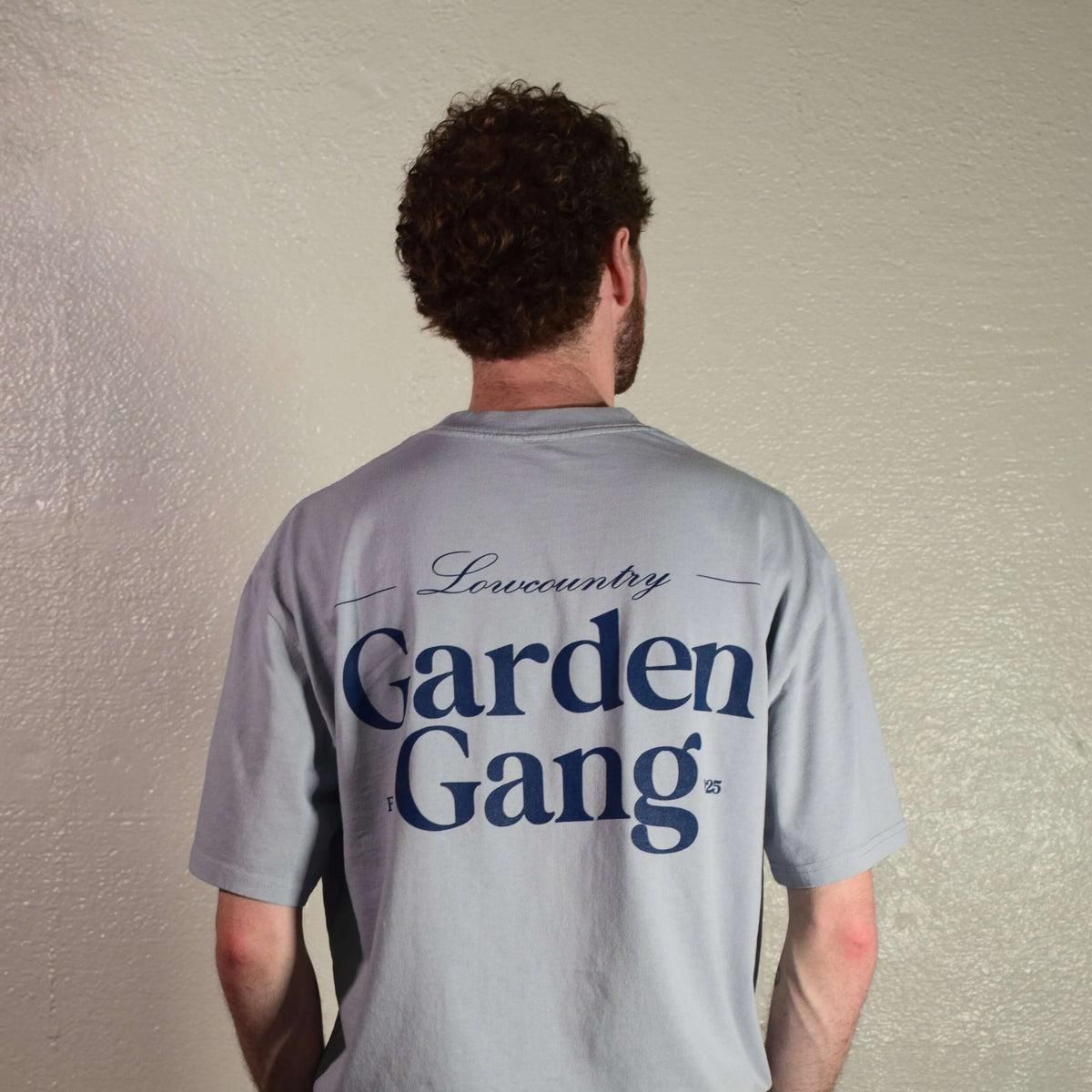 Lowcountry Garden Gang Tee Shirt featuring a stylish design on the back in gray cotton fabric.
