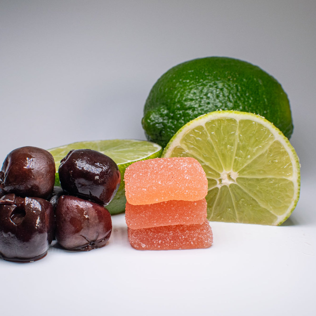 Dreamer++ Fast Acting Nighttime Gummies with cherry and lime slices for a refreshing and relaxing vibe.
