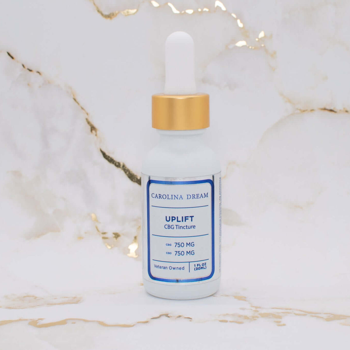Uplift CBD CBG tincture bottle with 750mg of each on a marble background.