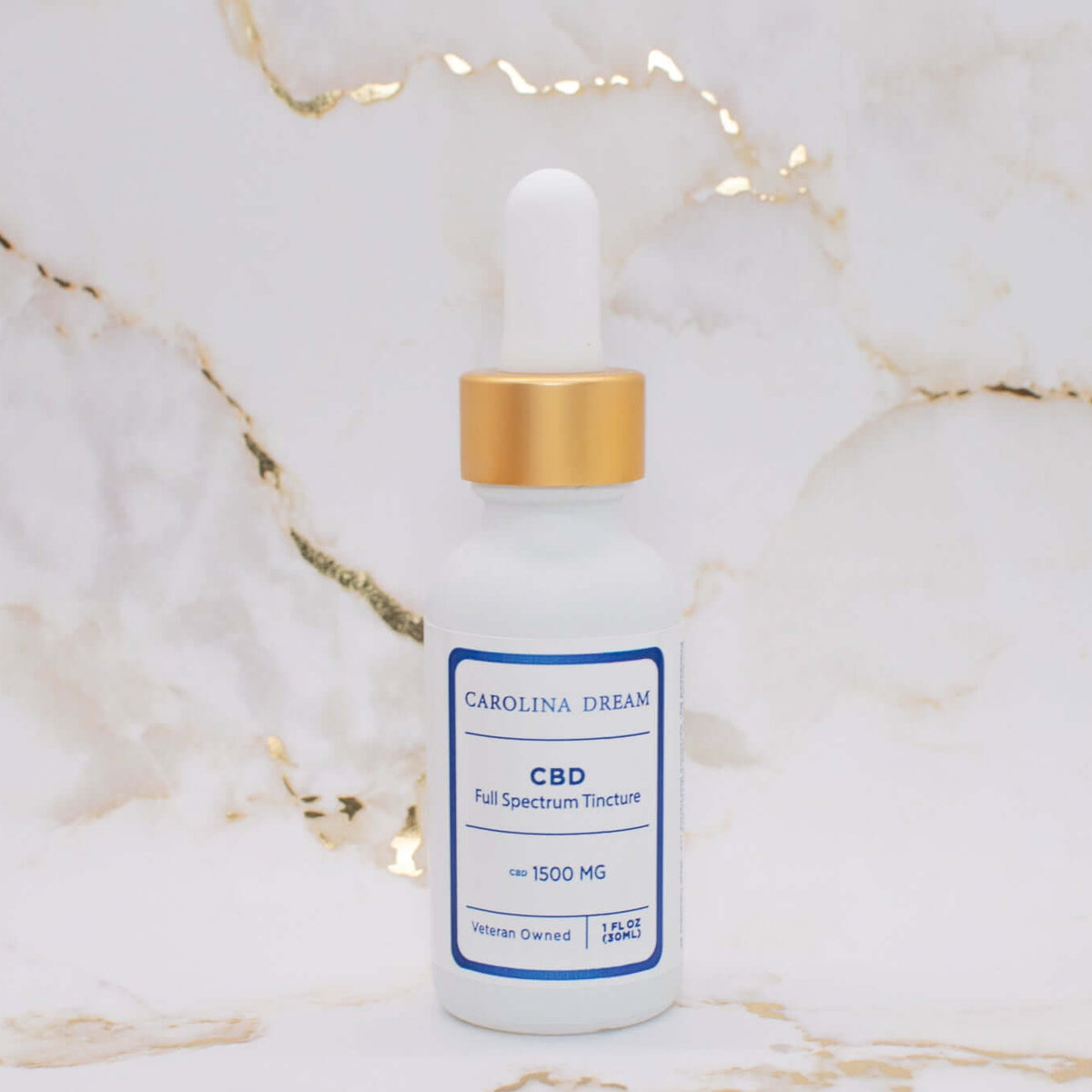 Full Spectrum 1500mg CBD Tincture bottle with dropper on marble background.